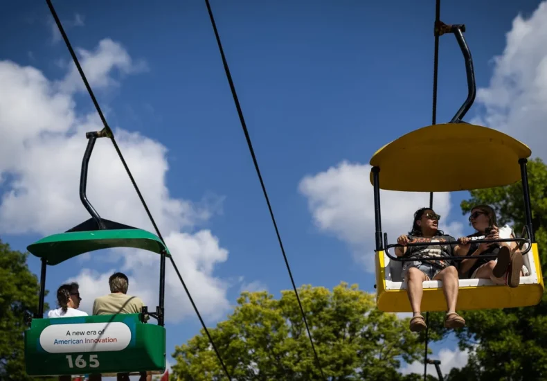 Fairgoers explore food stands and novelty items at the Minnesota State Fair opening day