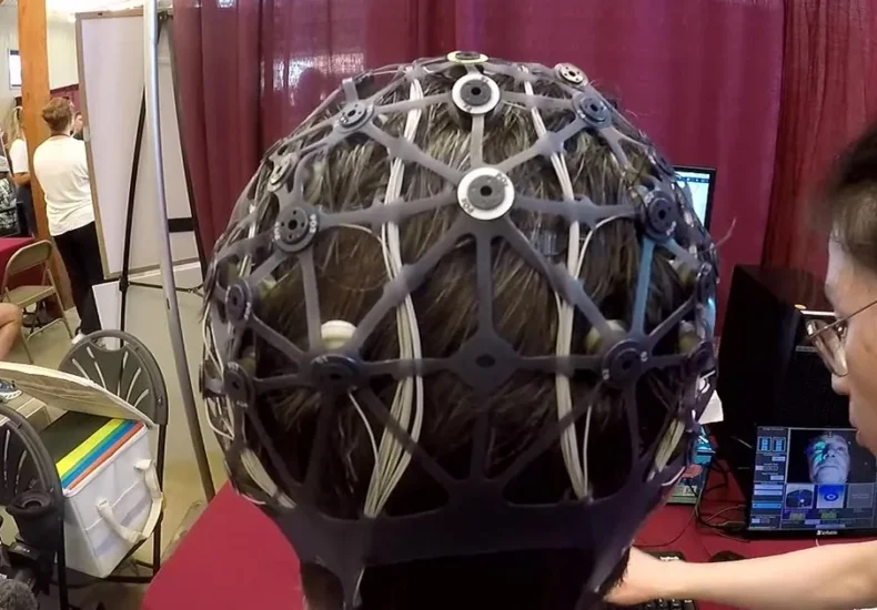 A Minnesota State Fair research booth where volunteers play Tetris while wearing a brain-monitoring cap